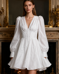 Emilia – An elegant dress with puff sleeves and a corset design